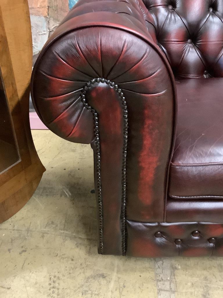 A Victorian style buttoned burgundy leather three seater Chesterfield settee, width 200cm depth 84cm height 72cm